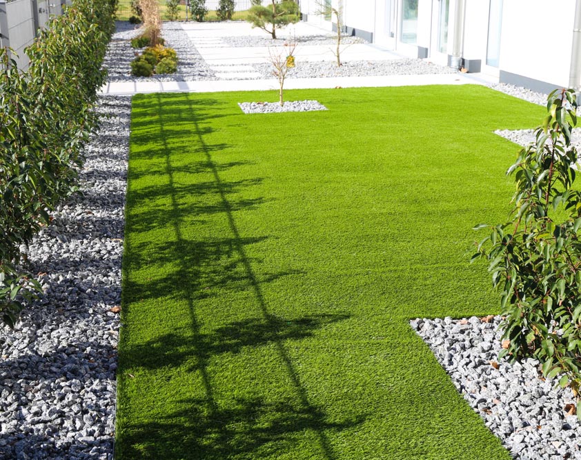 Backyard With Very Neat Rolled Turf — Turf Laying & Supplies in Townsville, QLD